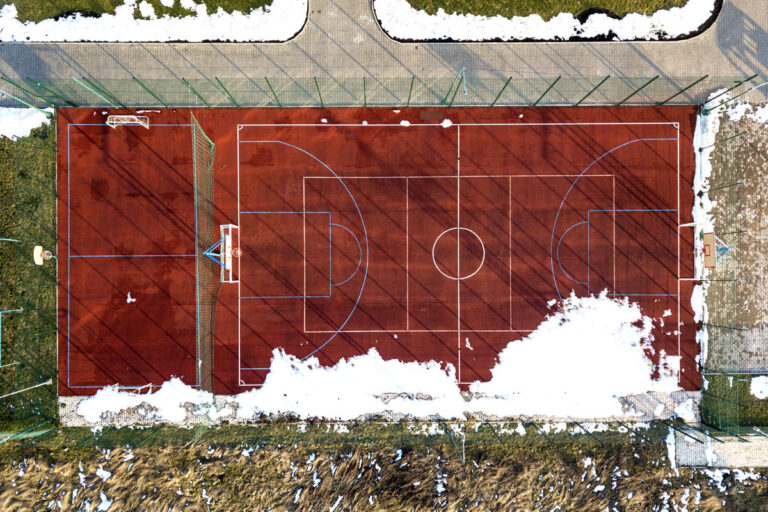 Top graphic view of basketball, volleyball or football court field red background, drone photography.